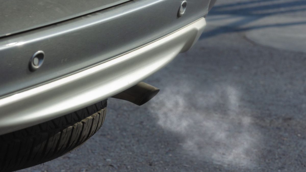 Car undergoing an exhaust emissions test in a laboratory