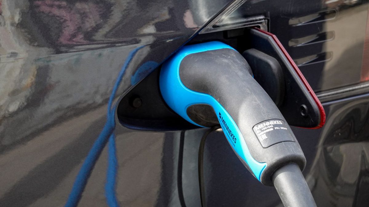 Electric cars plugged in at a charging point